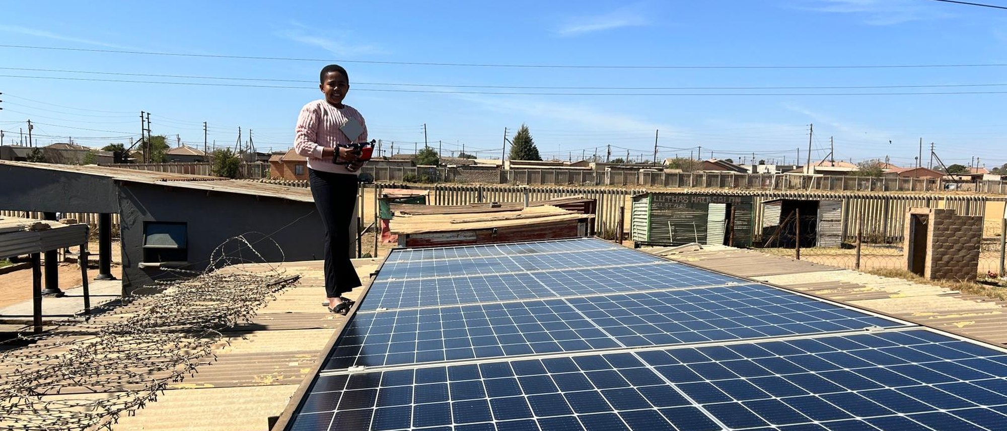 Community member checking a rooftop solar installation